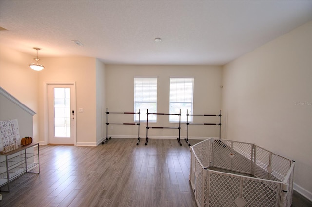 entrance foyer featuring a textured ceiling and hardwood / wood-style flooring