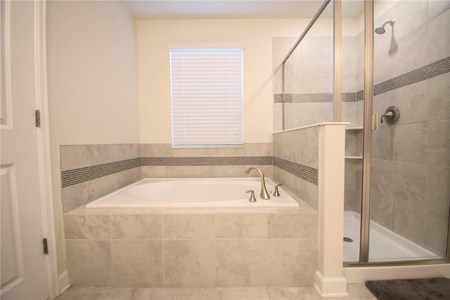 bathroom with independent shower and bath and tile patterned floors