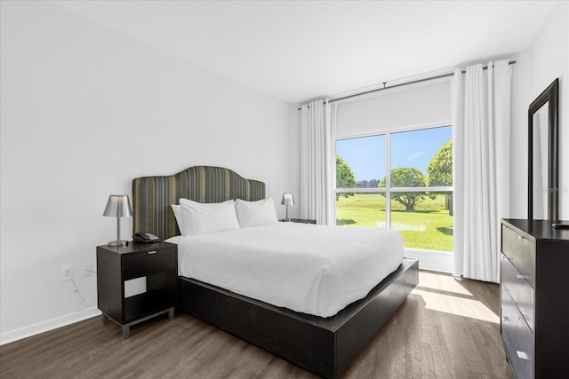 bedroom with wood-type flooring