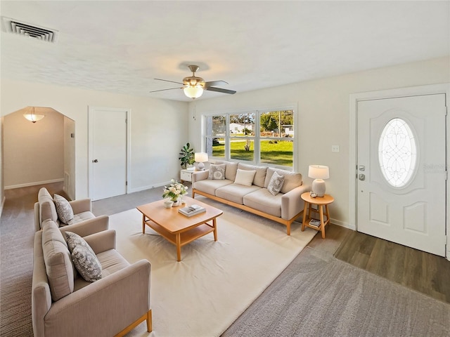 living room with hardwood / wood-style floors and ceiling fan