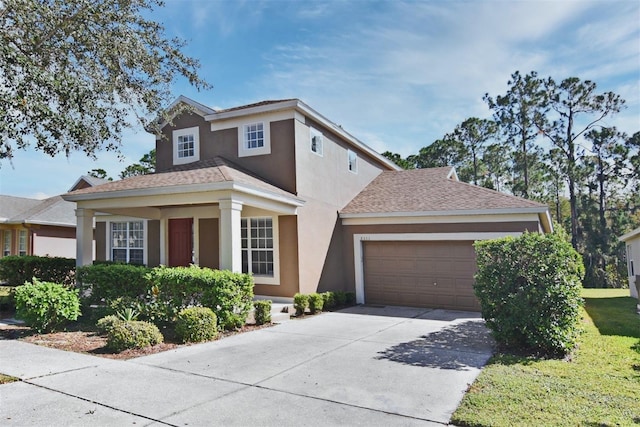 view of front of house with a front lawn and a garage