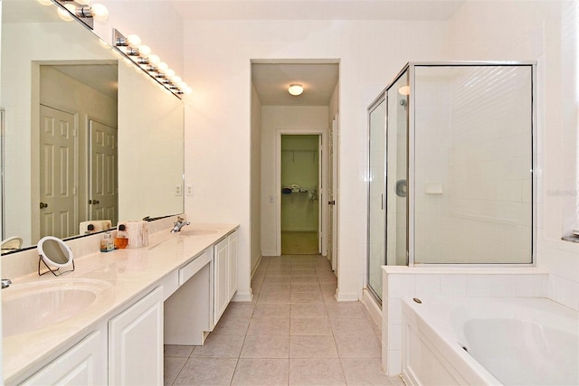 bathroom with vanity, plus walk in shower, and tile patterned flooring