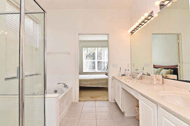 bathroom featuring vanity, tile patterned flooring, and plus walk in shower