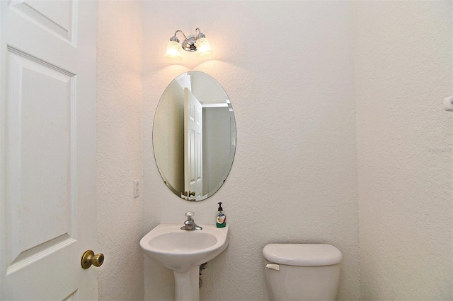 bathroom with sink and toilet