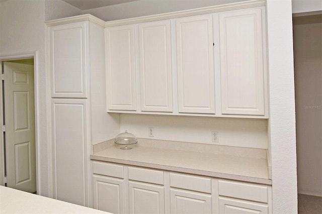 kitchen featuring white cabinetry