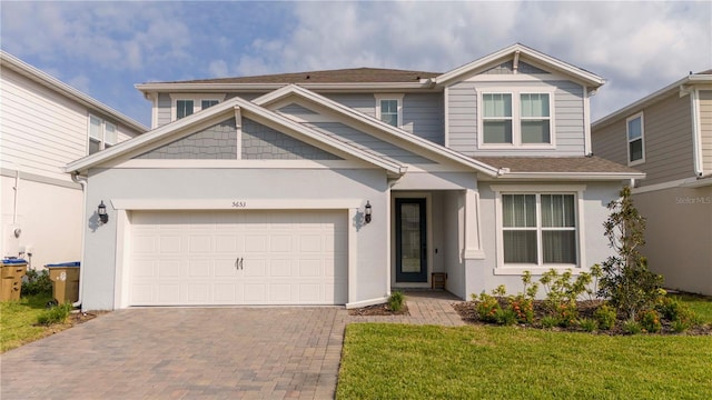 craftsman inspired home featuring a front lawn