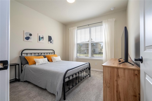 bedroom with light carpet