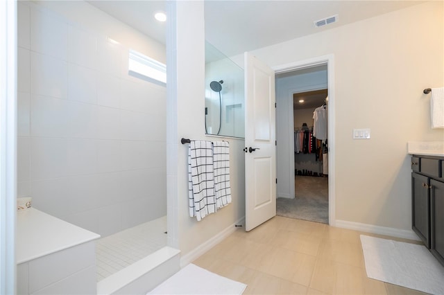 bathroom with vanity and a shower