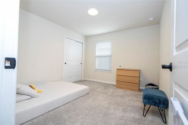 bedroom featuring light colored carpet