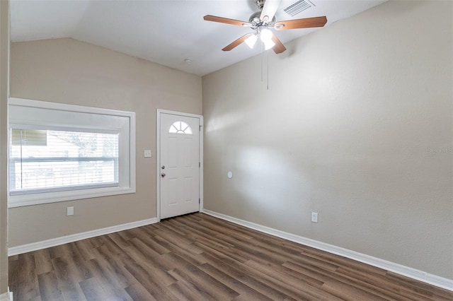 foyer with ceiling fan, vaulted ceiling, and dark hardwood / wood-style floors