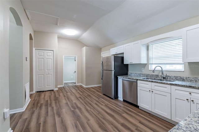 kitchen with white cabinets, appliances with stainless steel finishes, dark wood-type flooring, and sink