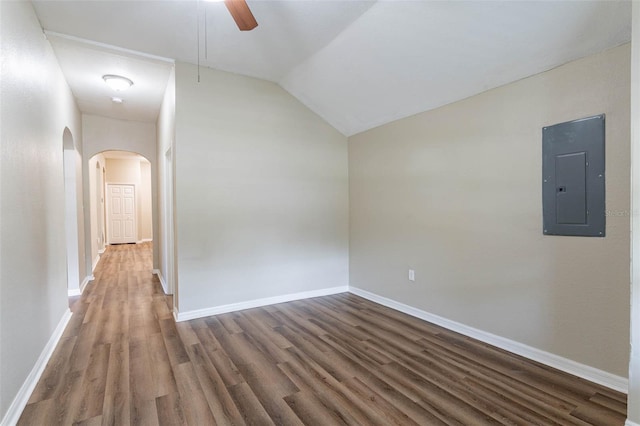 bonus room featuring electric panel, dark hardwood / wood-style floors, ceiling fan, and vaulted ceiling