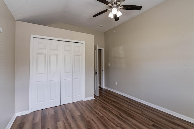 unfurnished bedroom with ceiling fan, dark hardwood / wood-style floors, and a closet