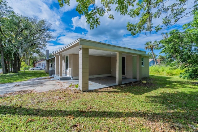 view of property exterior featuring a lawn