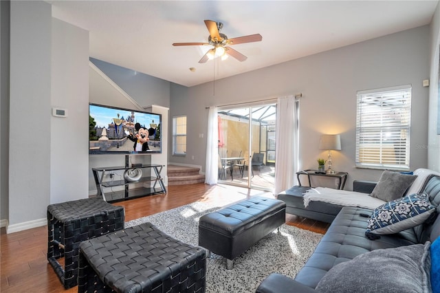 living room with ceiling fan and hardwood / wood-style flooring