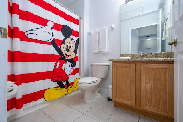 bathroom featuring vanity, toilet, tile patterned floors, and curtained shower