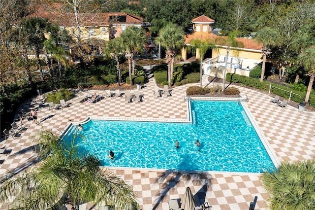 view of swimming pool with a patio