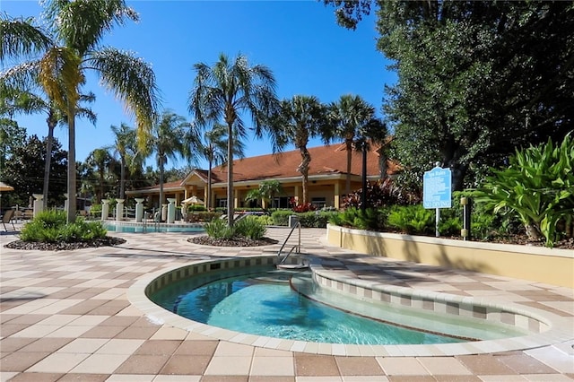 view of swimming pool featuring a patio