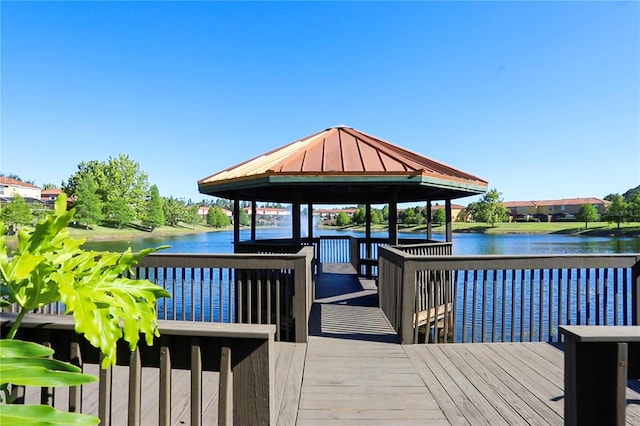 dock area featuring a gazebo and a water view