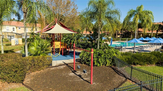 view of playground with a community pool