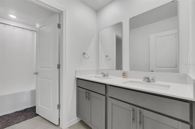 bathroom with shower / tub combo and vanity