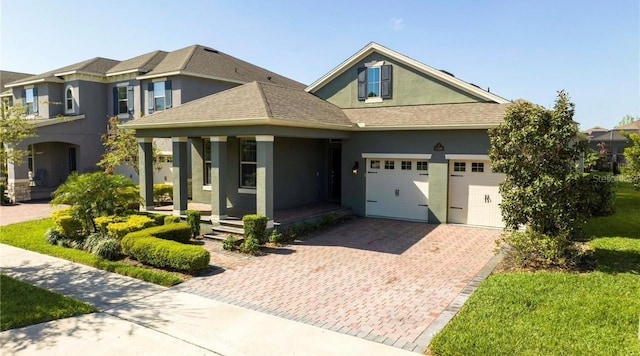 view of front of house featuring covered porch and a garage