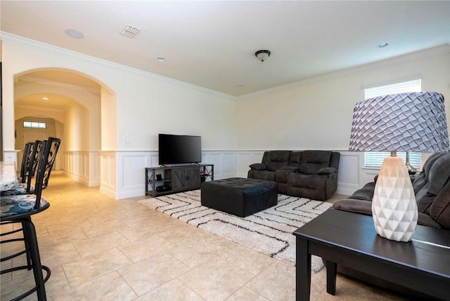 living room featuring crown molding