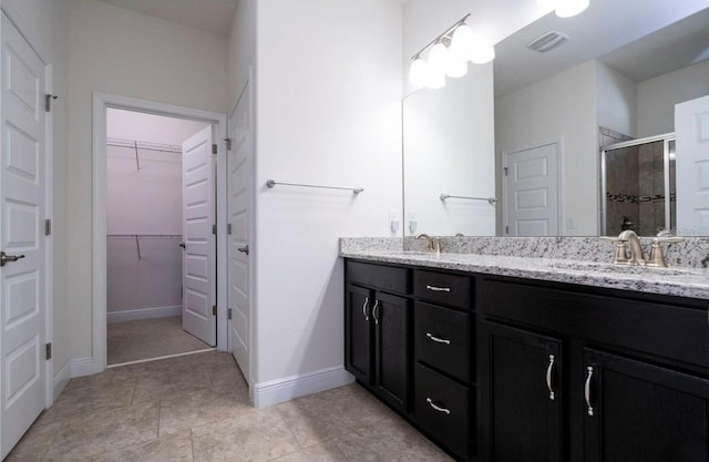 bathroom featuring vanity and walk in shower