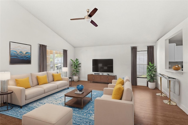 living room with lofted ceiling, hardwood / wood-style floors, and ceiling fan