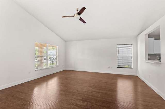 unfurnished living room featuring vaulted ceiling, dark hardwood / wood-style flooring, and ceiling fan