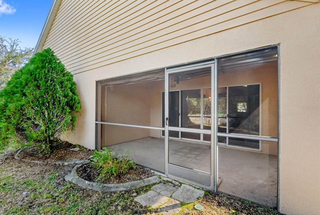 entrance to property with a patio area