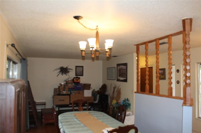 dining space with an inviting chandelier