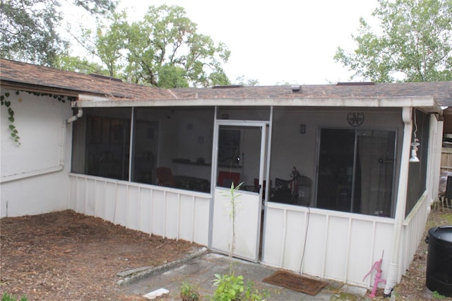 back of property featuring a sunroom