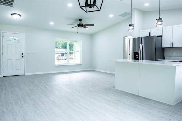 unfurnished living room featuring lofted ceiling, light hardwood / wood-style flooring, and ceiling fan