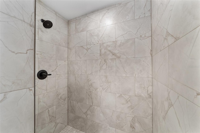 full bathroom with tiled shower