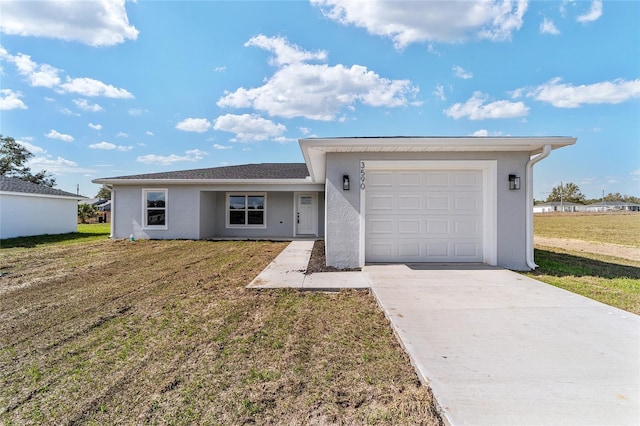 ranch-style home with an attached garage, driveway, a front lawn, and stucco siding