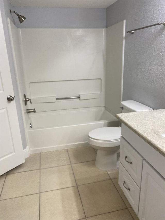 full bathroom featuring vanity, toilet, bathing tub / shower combination, and tile patterned flooring