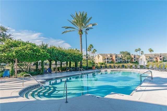 view of swimming pool with a patio