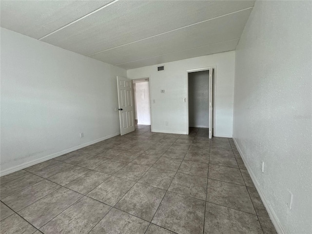 view of tiled spare room