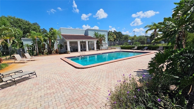 view of swimming pool featuring a patio area