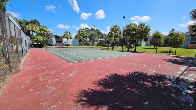 view of sport court with basketball hoop