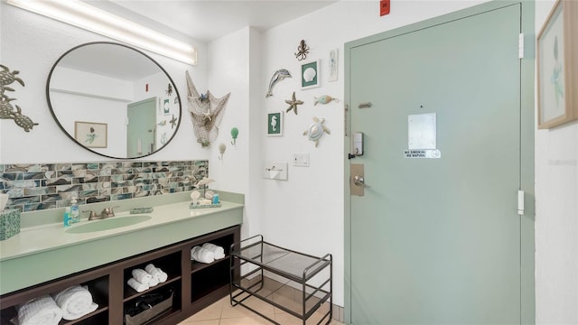 bathroom with vanity, backsplash, and tile patterned floors