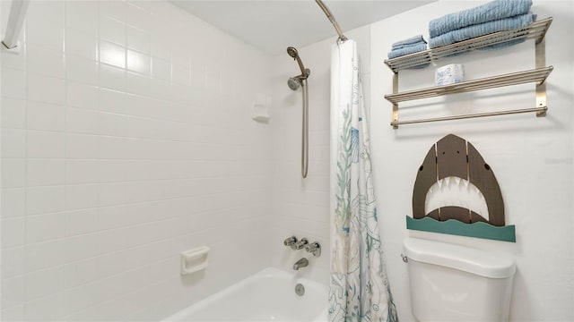 bathroom featuring shower / tub combo and toilet