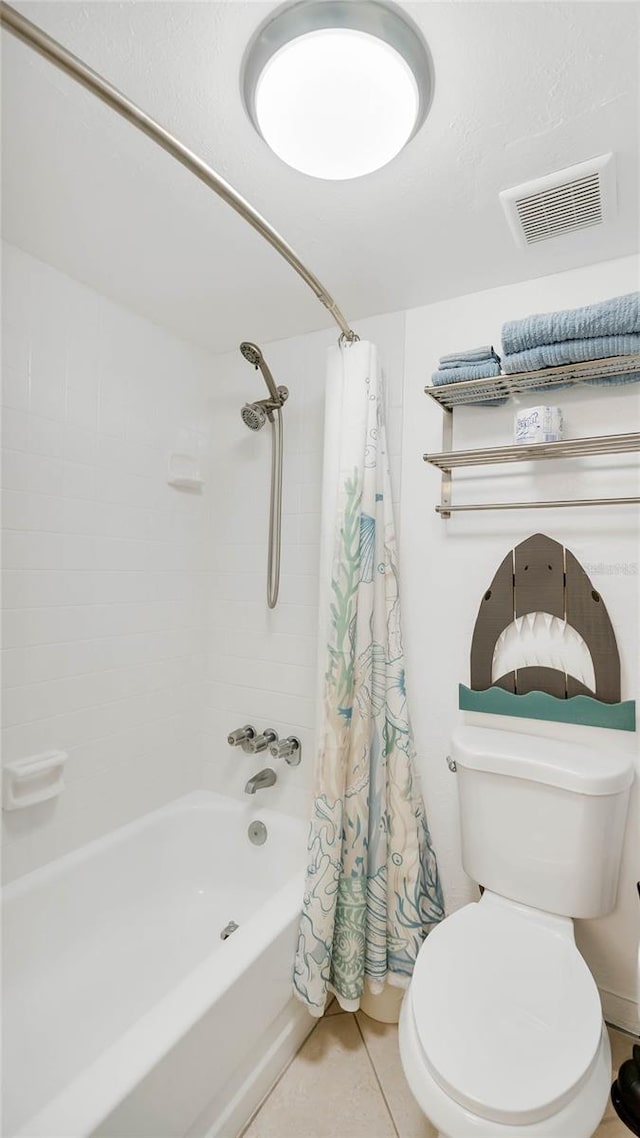 bathroom featuring tile patterned floors, toilet, and shower / bathtub combination with curtain