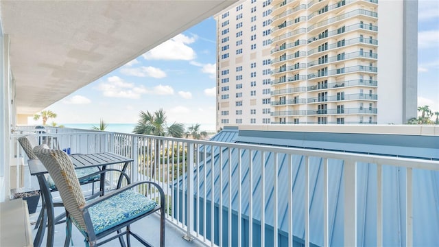 balcony featuring a water view