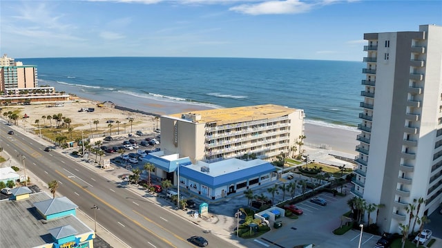 aerial view with a water view and a view of the beach