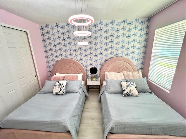 bedroom featuring light hardwood / wood-style flooring and a closet