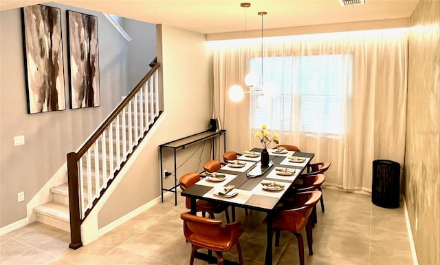 dining room with tile patterned flooring