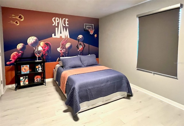 bedroom with hardwood / wood-style flooring