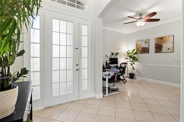 tiled home office with ceiling fan and ornamental molding